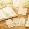 占いの基礎を学ぶ本とカードが木の机に並ぶやさしいイラスト